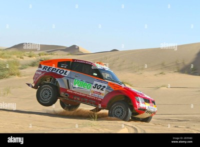 french-driver-luc-alphand-and-french-co-driver-giles-picard-in-their-mitsubishi-302-through-the-8nd-stage-of-the-2006-lisbon-dakar-rally-between-atar-and-nouakchott-mauritania-on-january-.jpg